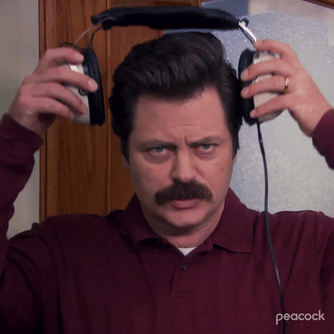 Gif of Ron Swanson putting on his noise cancelling headphones.