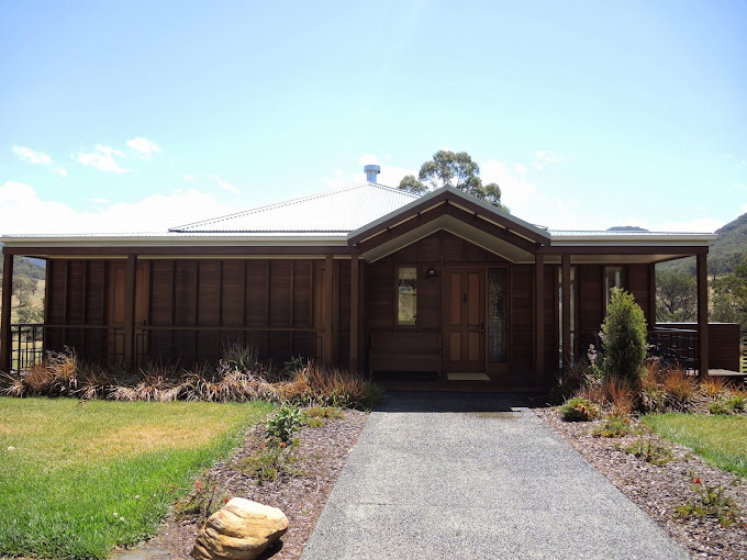 a house with a driveway and grass