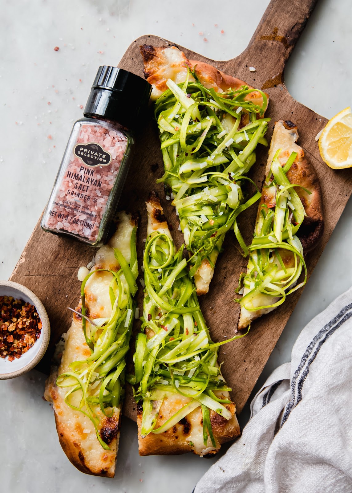 Himalayan sea salt product placement with asparagus pizza