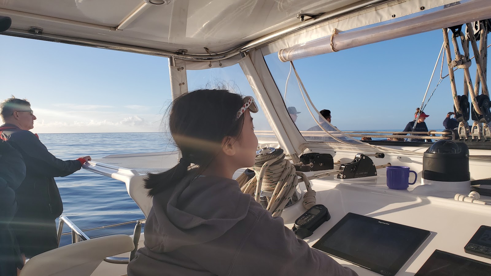 Image of a girl steering a boat on a Maui tour to Lanai