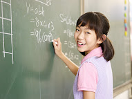 a child practicing math variables on a whiteboard