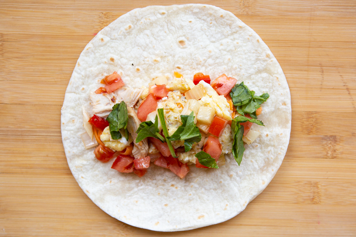 fillings for chicken breakfast burrito on a tortilla