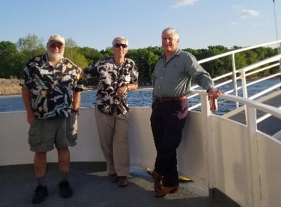 A group of men standing on a bridge

Description automatically generated with medium confidence