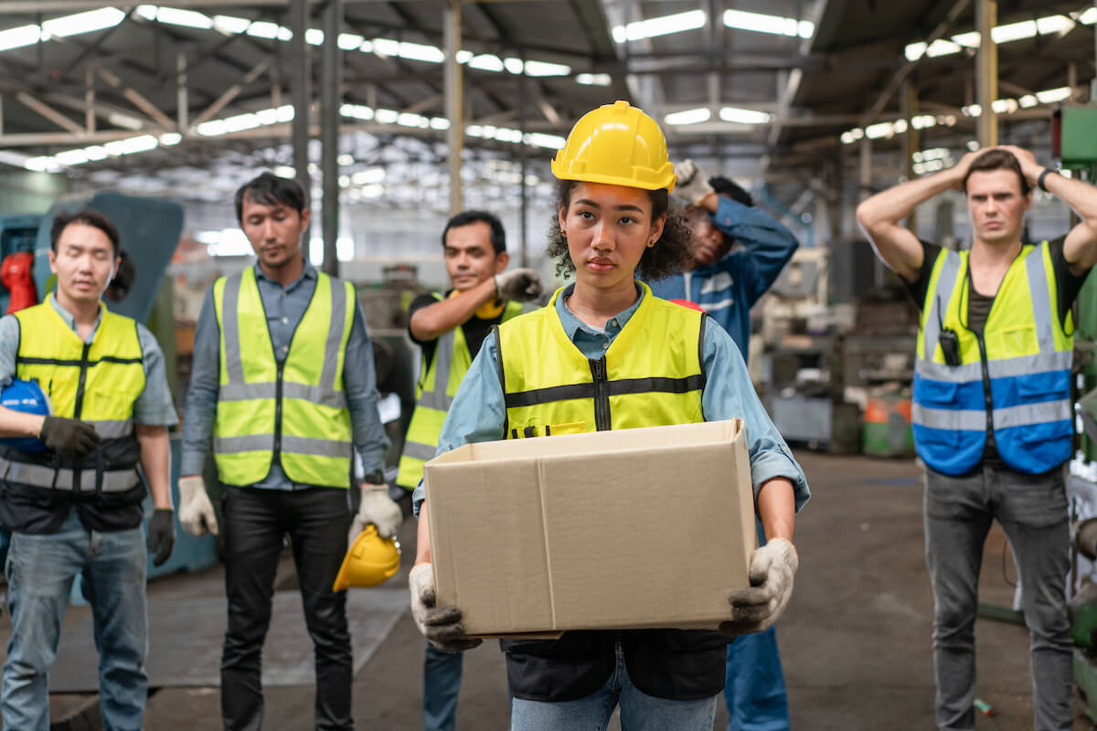 Workers watching their colleague leave