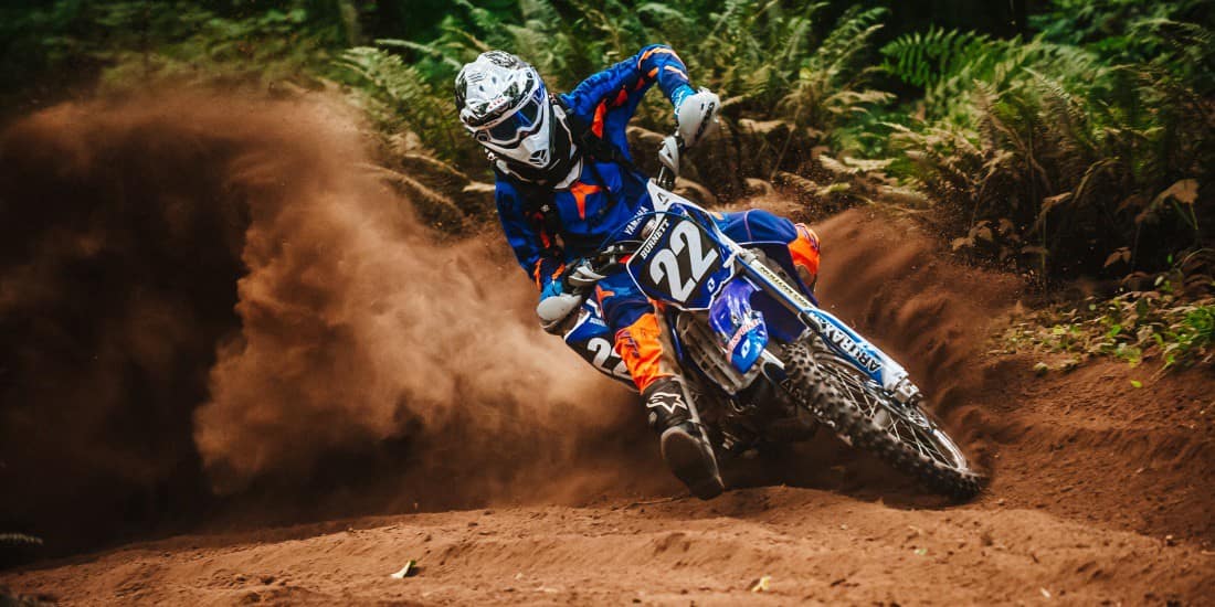 Dirt bike rider powers out of turn - thrilling off-road action