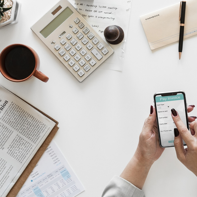 woman on phone invoicing