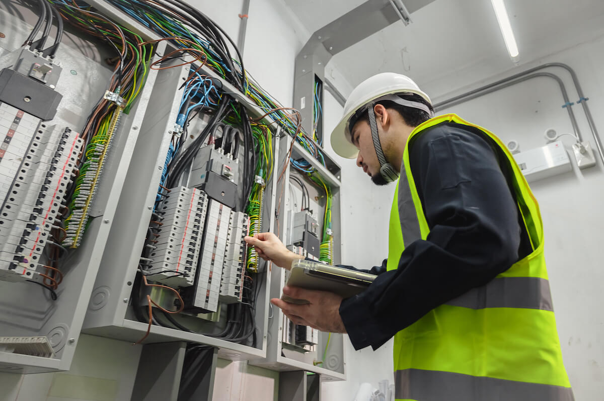 Engineer checking the electrical panel board