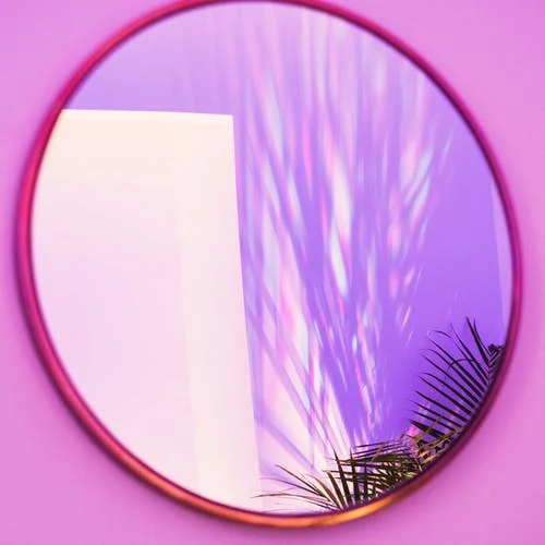 mirror on purple wall