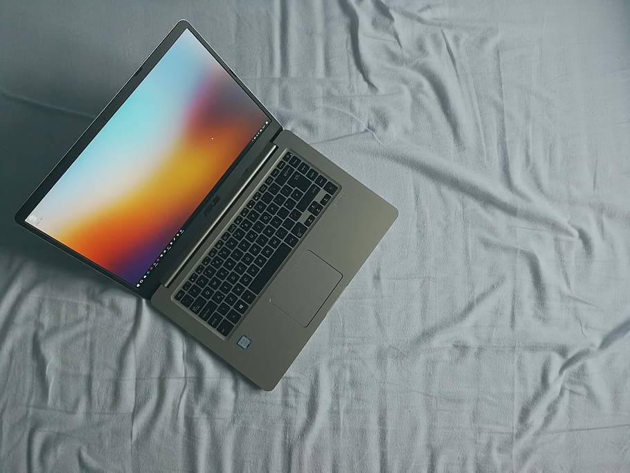 This image shows the laptop in the bed.