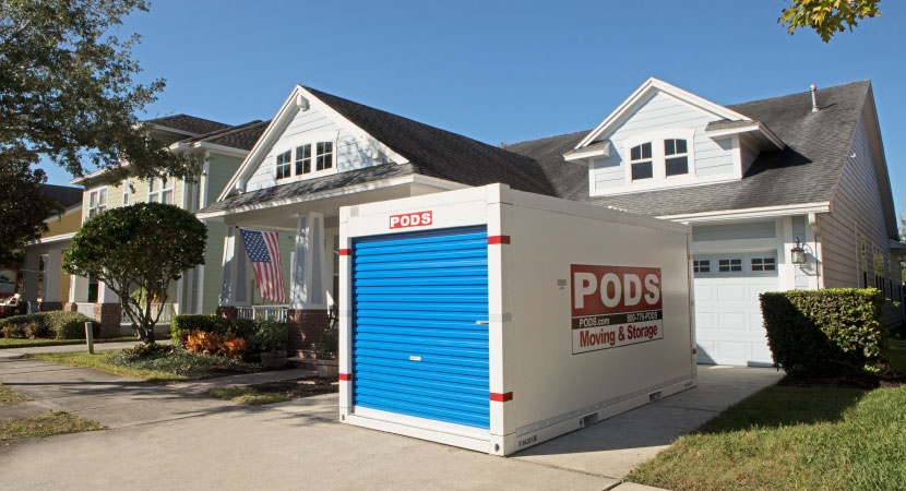 A PODS portable moving & storage container in a driveway