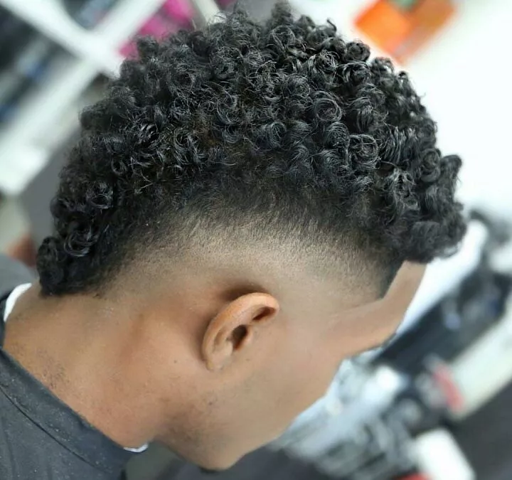 a man showing his curly zoomer haircut