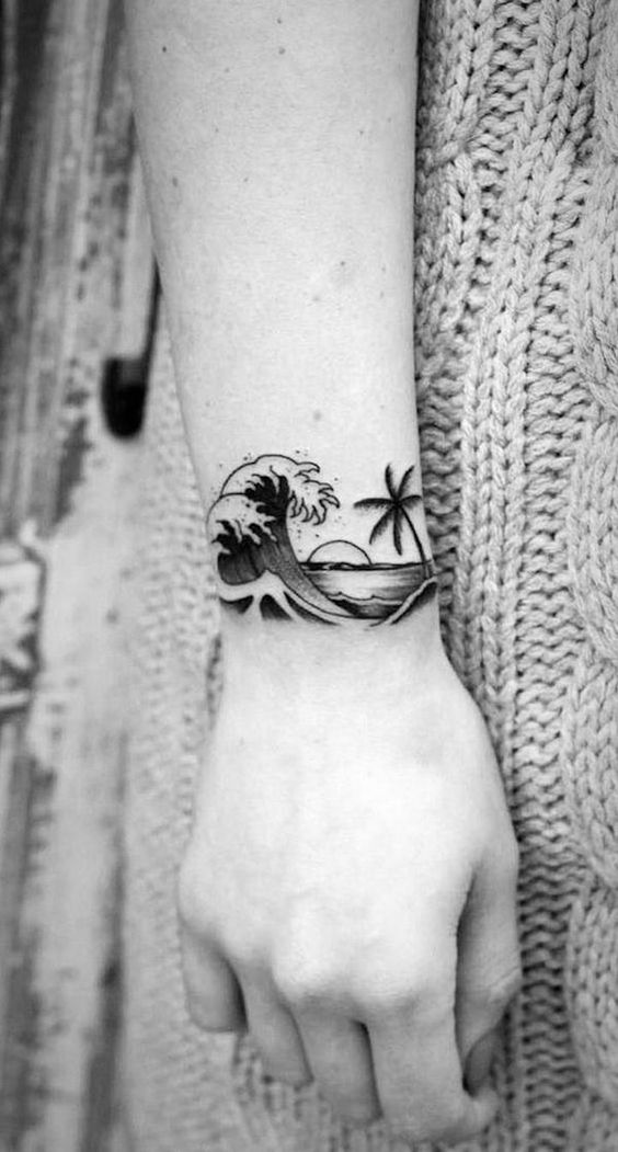 Another version of the wrist tattoo with a sun and a wave