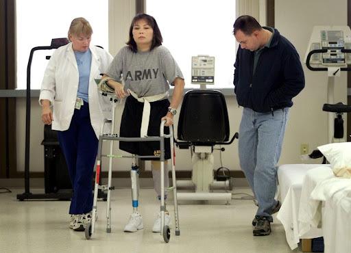 Senator Duckworth re-learning how to walk on prosthetic legs