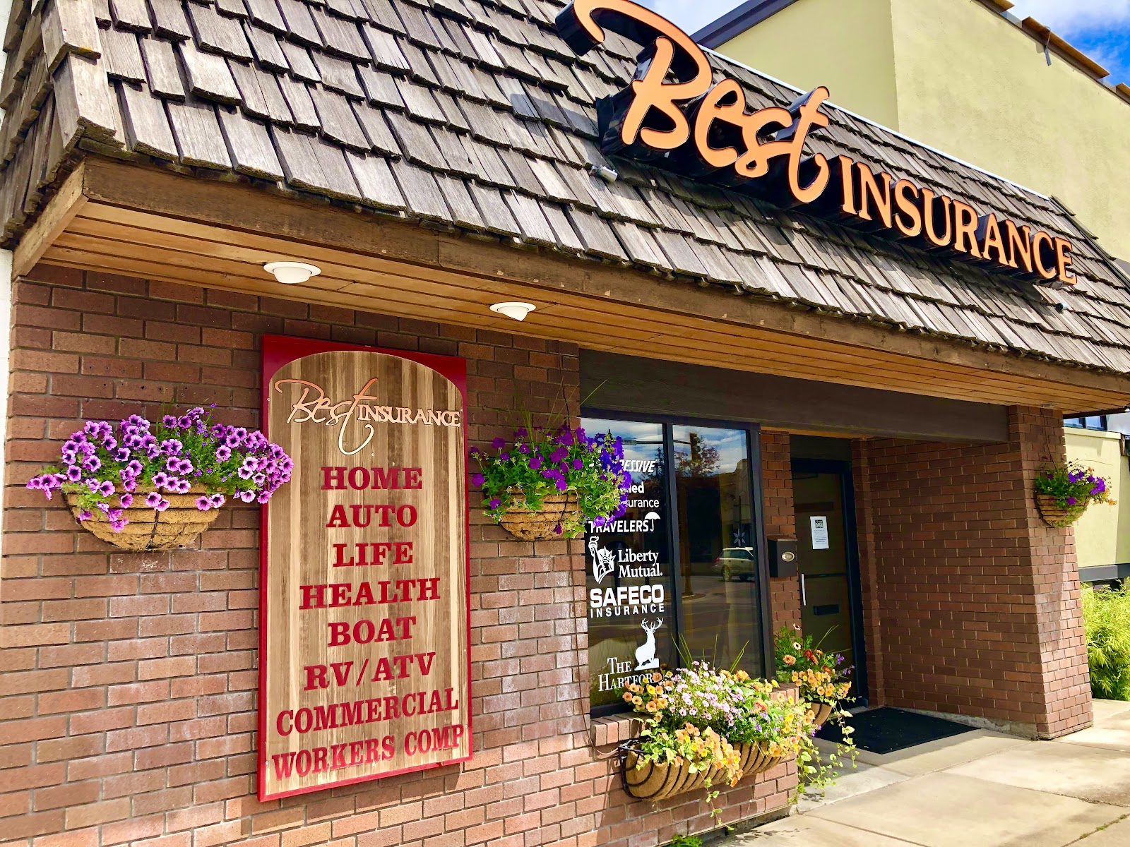 a sign above a store in a brick building