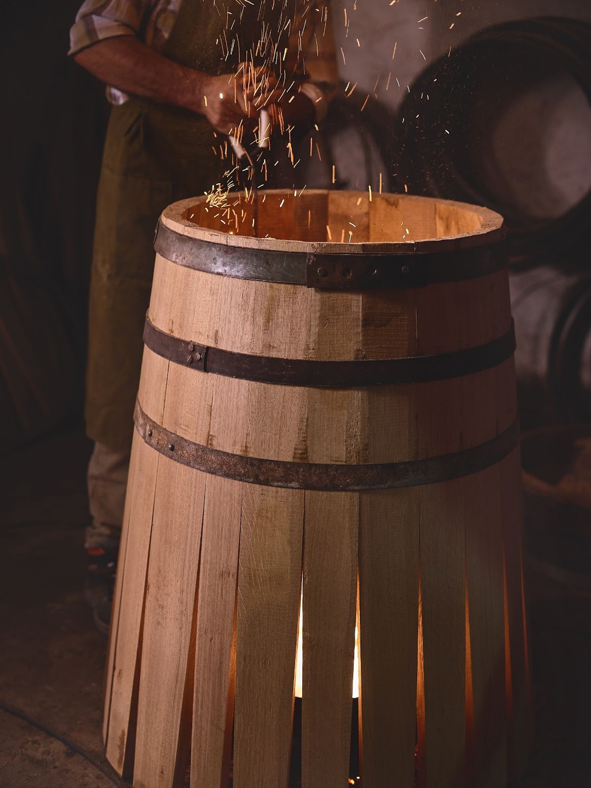 picture of a barrel over a fire, smoking and burning.