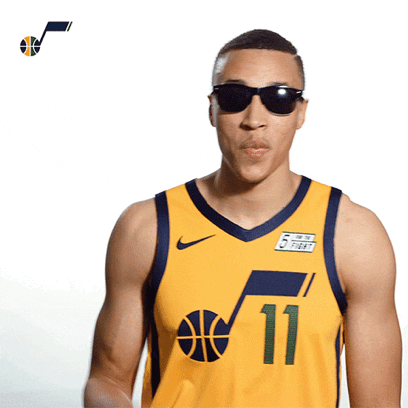 A gif of a Utah Jazz NBA player taking off his sunglasses 