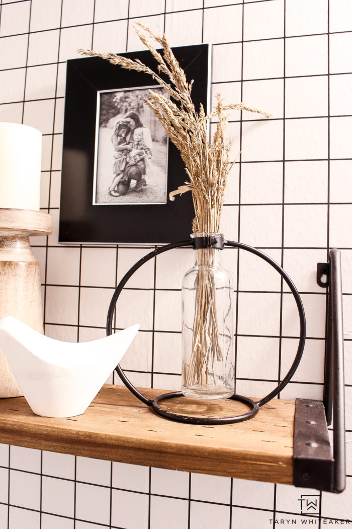 Bathroom with fall inspired wheat in a vase. 