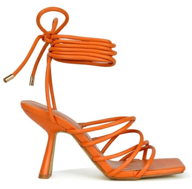 A pair of orange sandals

Description automatically generated with low confidence