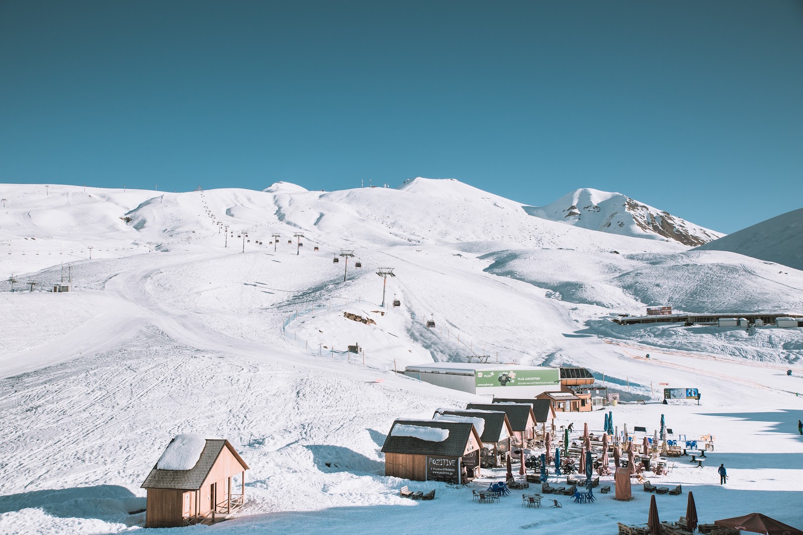 Georgian ski slopes with clear blue skies in the horizon.