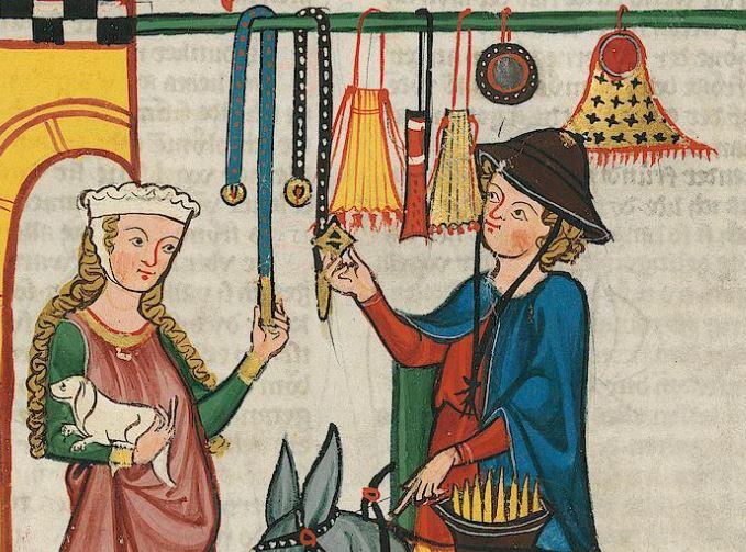 A drawn image of a blonde woman in 14th century German dress, shopping with a blonde gentleman in a blue cloak shopping for purses and belts.