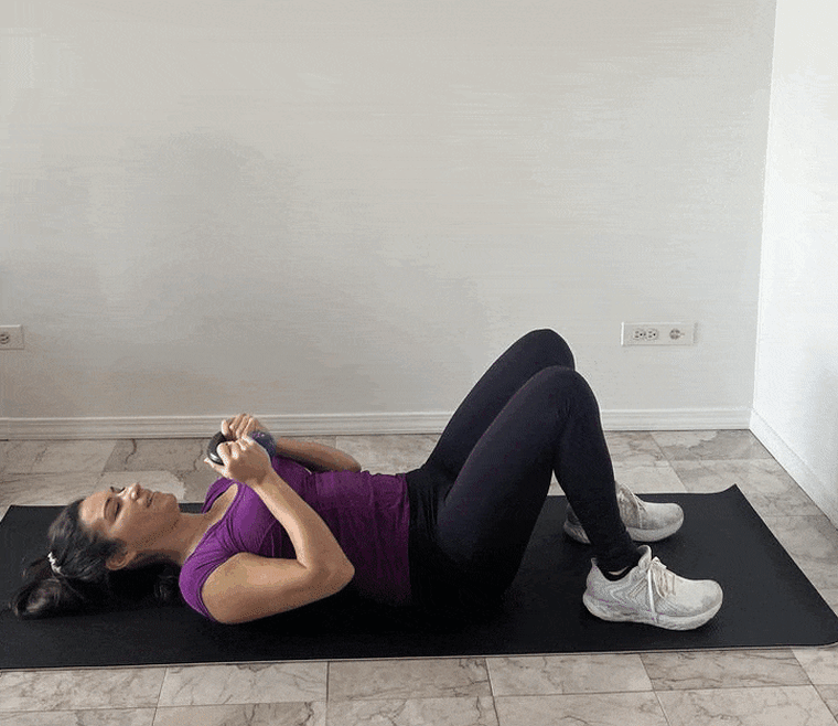 Sit up to press kettlebell