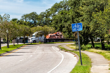 Tarpon Springs, Florida Greek town empty road street with blue sign for bike lane route for bicycles