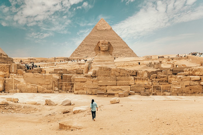 Person walking to pyramid