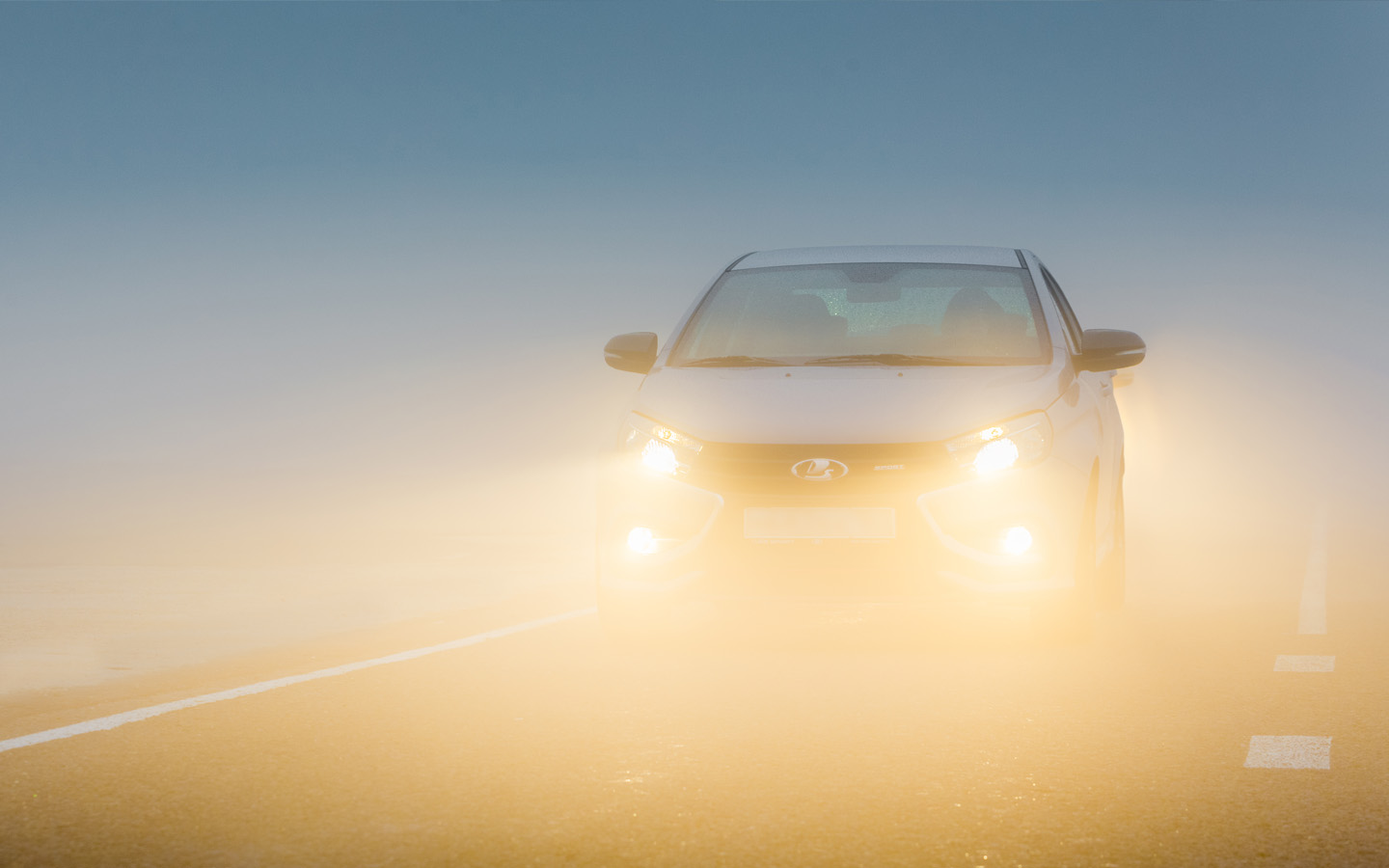 preparing your car for winter: car driving in fog