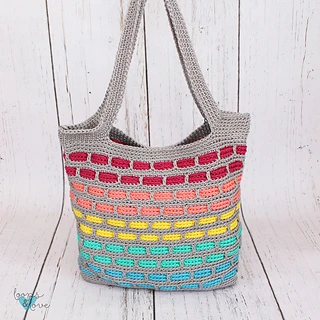 gray and multicolor tote on wooden background