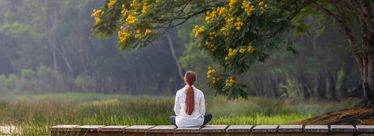Women practising meditation in her path for becoming a medium