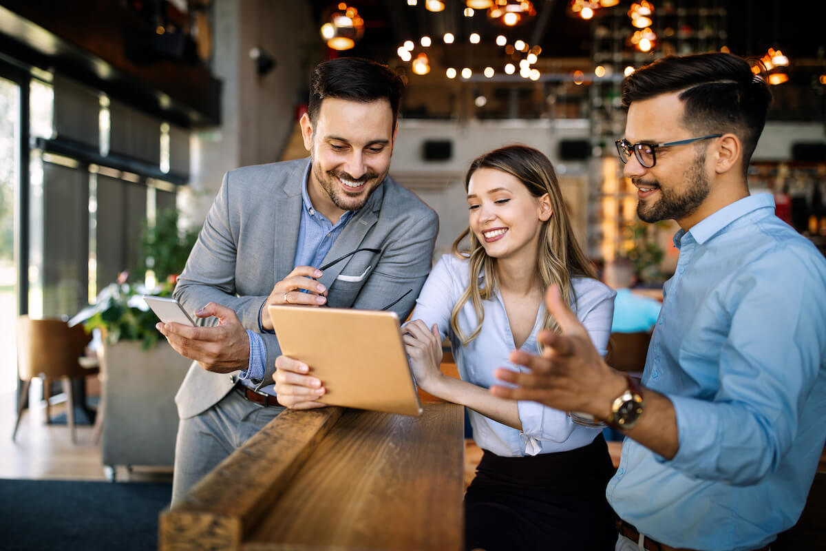 Benefits administration: employees watching something on a tablet