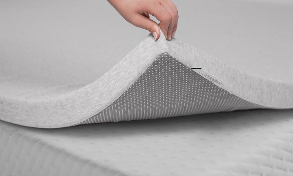 A non-slip pad can keep a mattress topper from sliding off.