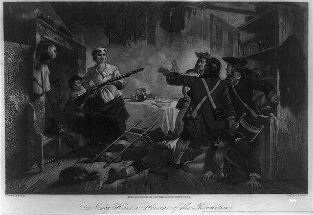 Woman pointing a rifle at some soldiers. One lies dead on the floor and the others are cowering.