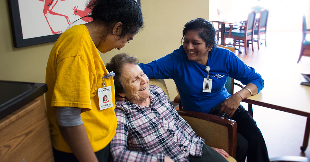 Senior woman with nurses