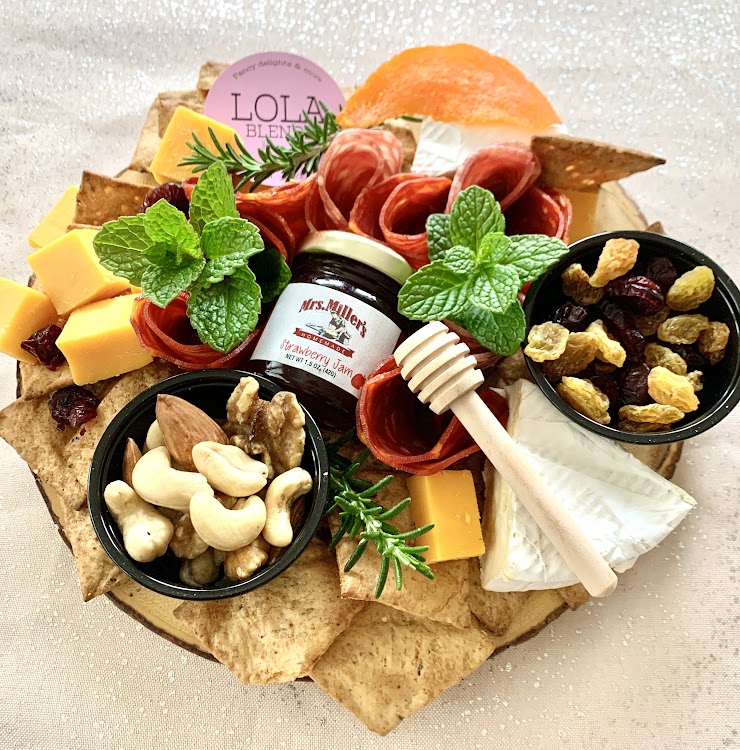 This package comes with a variety of meats, cheeses, nuts, dried fruits, crackers, and jam, dressed up on a crafted wooden board. Ready to serve and enjoy!
