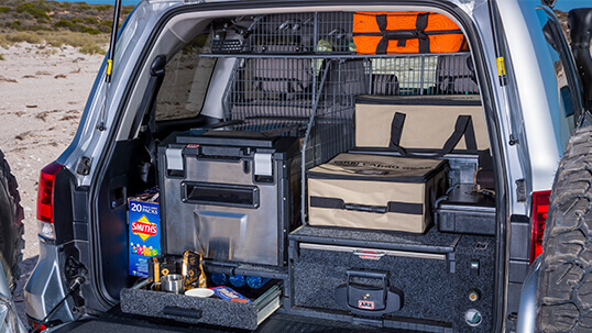 Rear view of an SUV with the ARB Outback Drawer System installed.