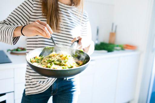 A person eating a bowl of food

Description automatically generated with low confidence