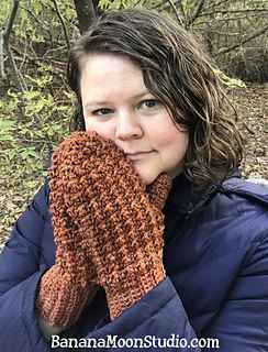 a lady wearing pemba mittens