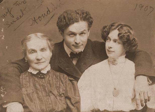  A photograph of Houdini embracing his mother and wife
