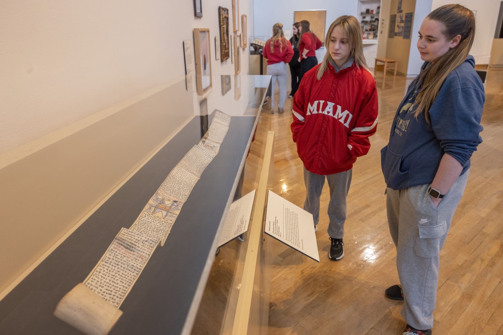 Miami University students from the Global Book Lab course view an Ethiopian Prayer Scroll on display at the Art Museum
