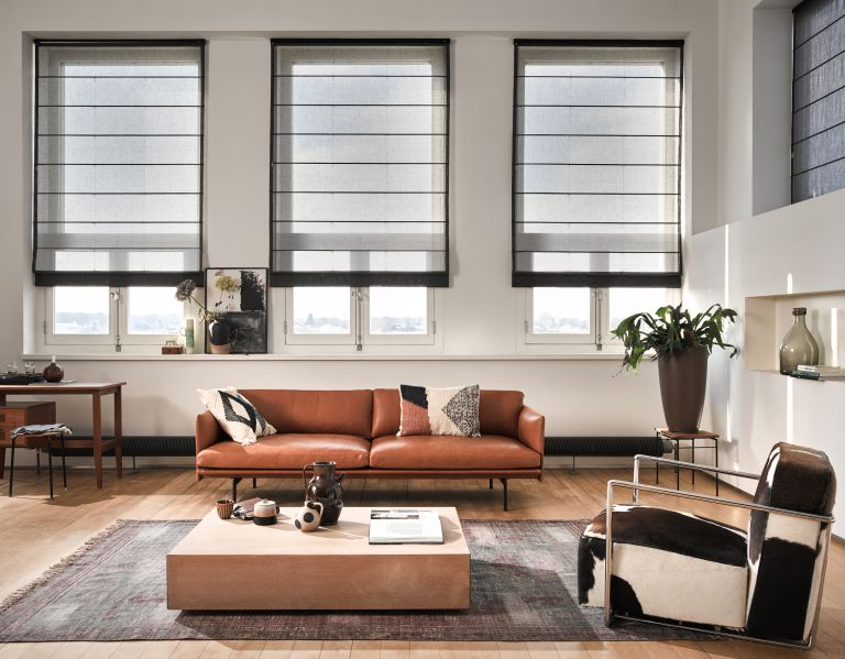 Uniformed, minimalist look with roller blinds to keep a cool home without warming the planet