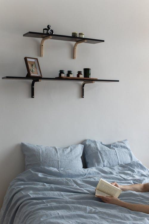 Free Shelves Above a Bed Stock Photo