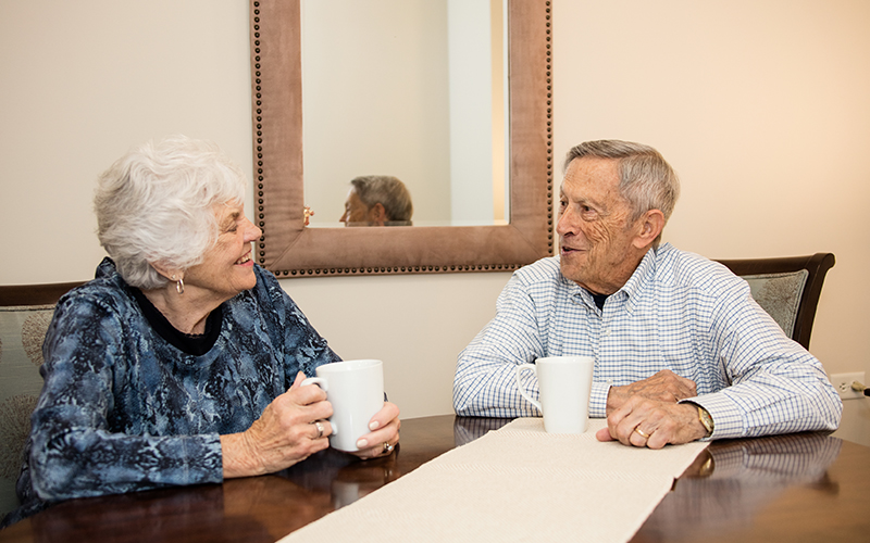 Oaks at Bartlett residents talking over coffee