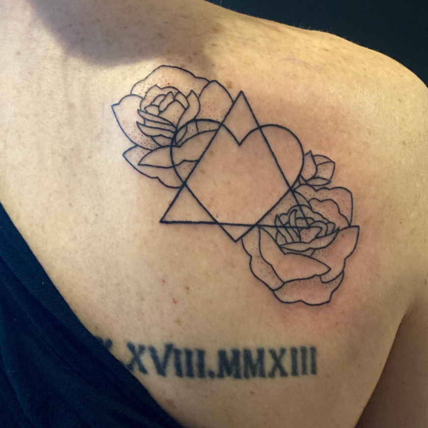 adoption symbol tattoo on shoulder