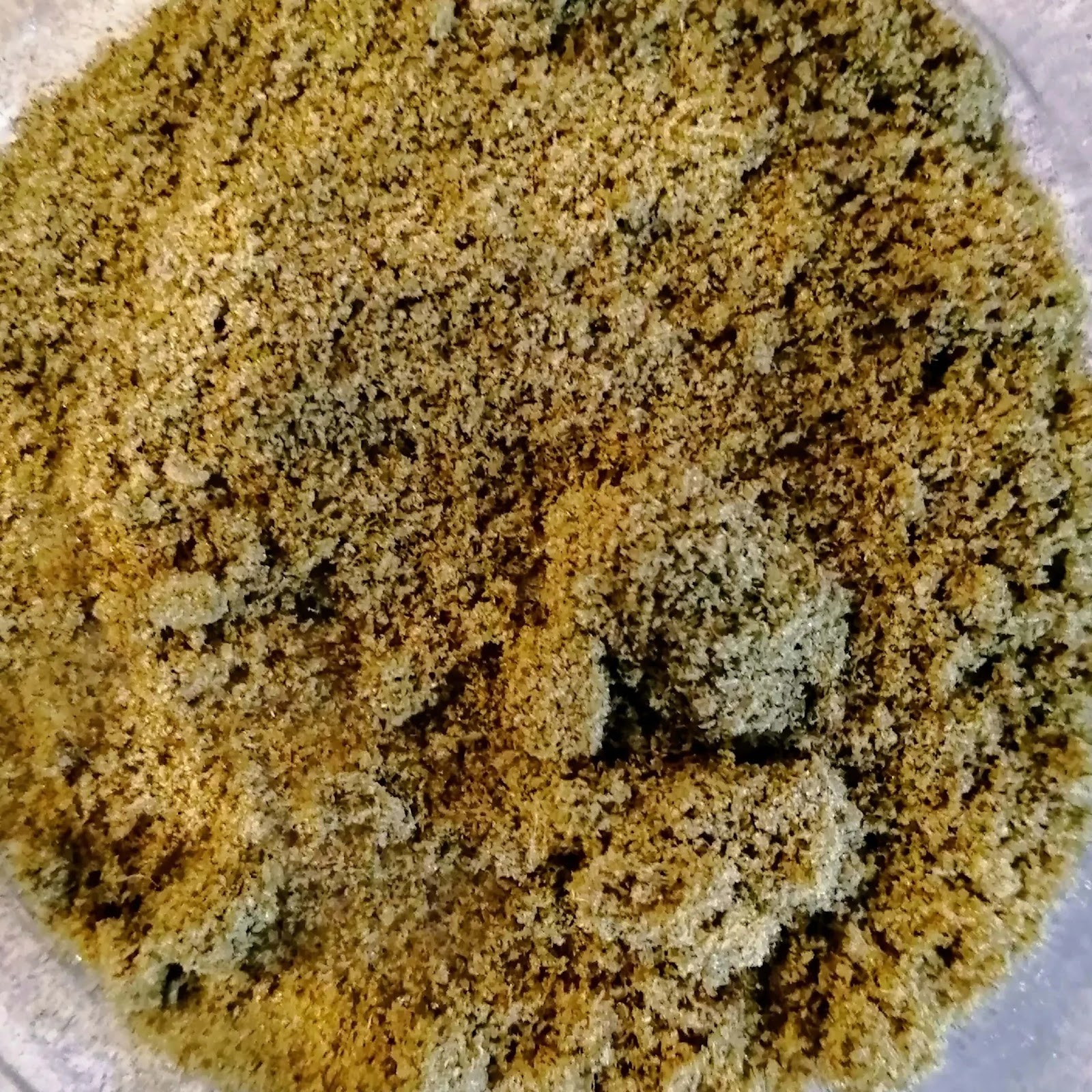 Finely ground brownish-green cbd kief
