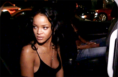 Rihanna gives a disapproving/suspicious look and rolls up the tinted car window.