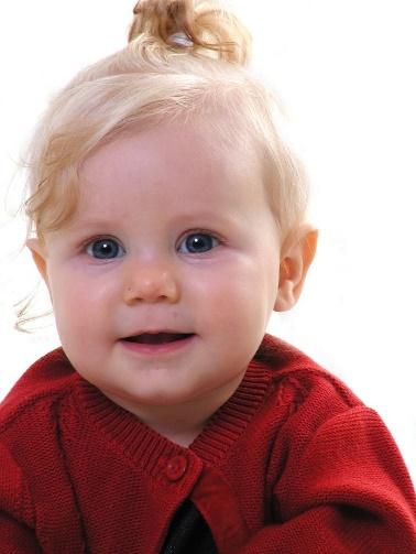A baby with blonde hair

Description automatically generated with low confidence