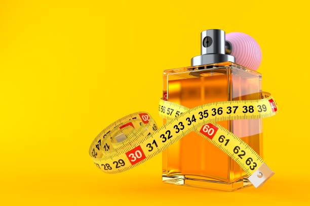 Perfume bottle with centimeter Perfume bottle with centimeter isolated on orange background. 3d illustration Perfume Bottle Sizes stock pictures, royalty-free photos & images
