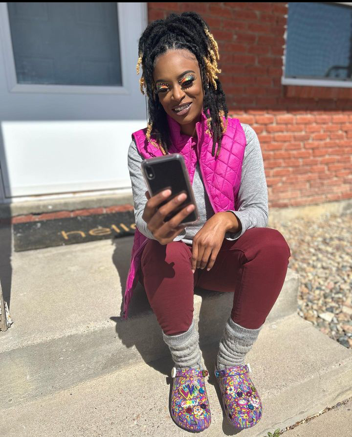 Beautiful lady rocks a beautiful pink jacket  pairing it with this elegant foootwear