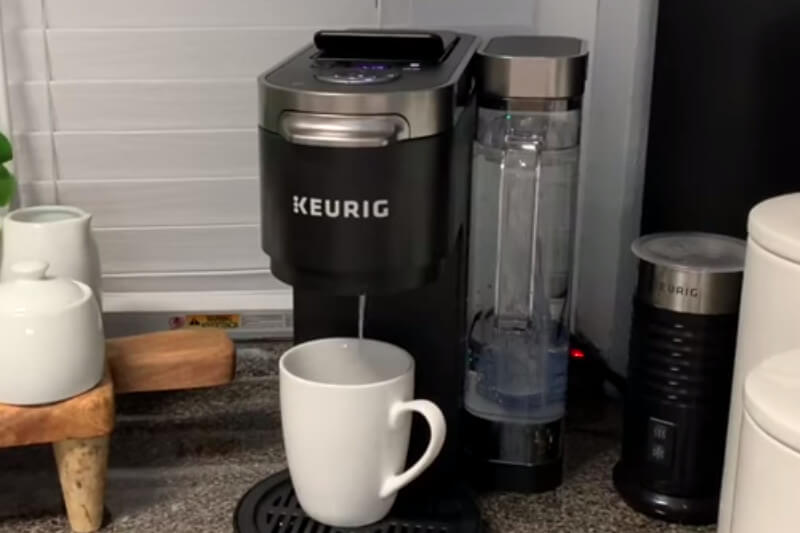                                   Keurig machine dispensing water during the descaling process